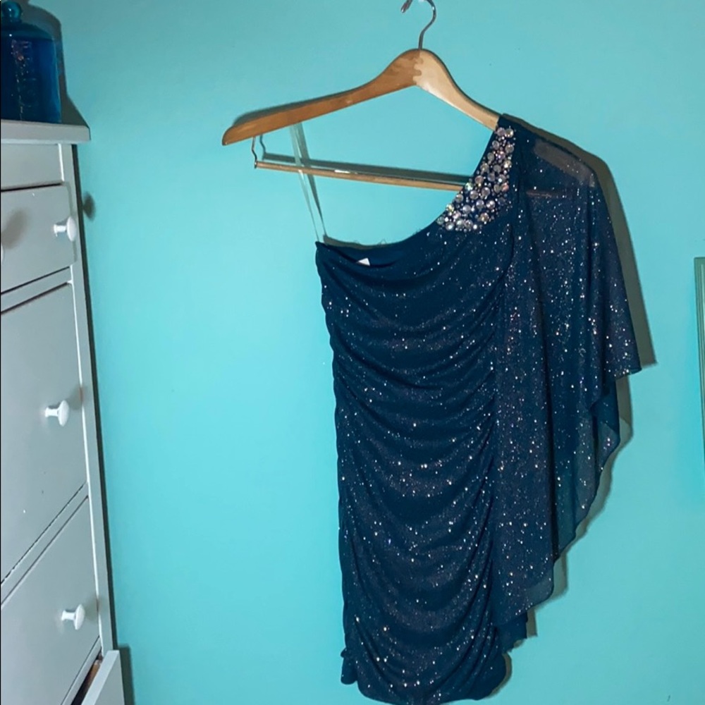 Asymmetric off the shoulder cocktail dress.